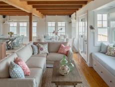 Coastal Living Room With Tan Sectional and Wood Ceiling