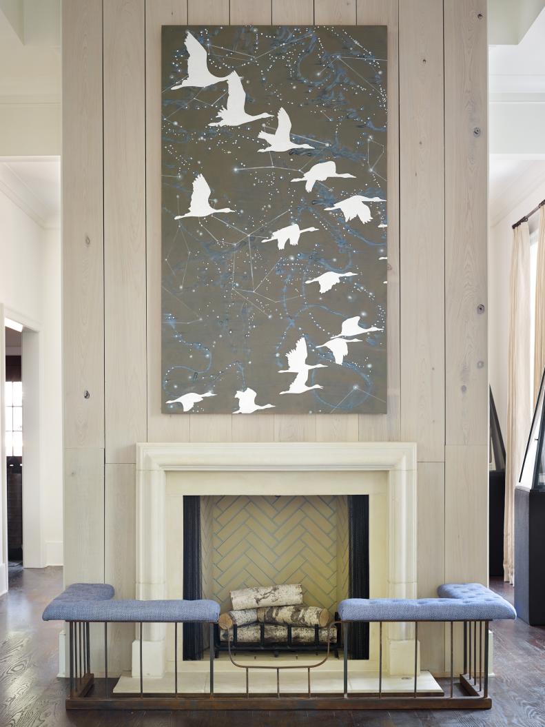 Green Bird Painting Above Fireplace With Brick Backing