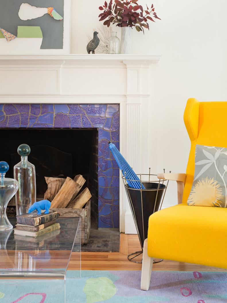 White Living Room With Blue Fireplace Surround and Yellow Chair