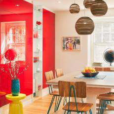 Contemporary Dining Room With High-Gloss Red Accent Wall