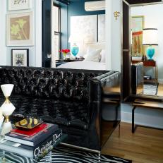 Small Apartment Living Room With Black Tufted Leather Sofa