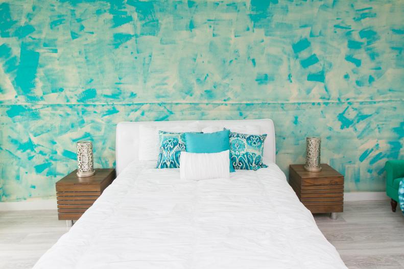 Melissa created texture on the room's feature wall by gluing burlap to the wall, then painting over it with bright turquoise paint. 