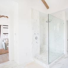 Glass-Enclosed Marble Shower in Crisp White Bathroom