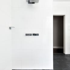 Modern Open Concept Shower With Black Pebble Floor
