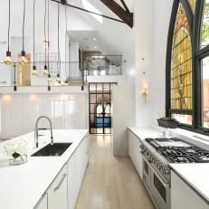 White Open Plan Modern Kitchen With Pendants