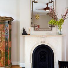 Eclectic Living Space Features Vintage Marble Mantel