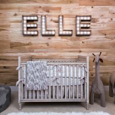 Neutral Rustic Nursery With Marquee Lights