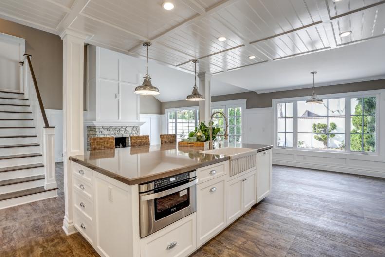 Airy White Kitchen With Rustic Hardwood Floors