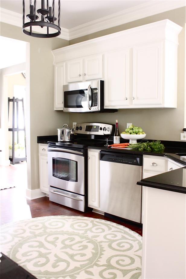 White kitchen cabinets with crown molding by HGTV