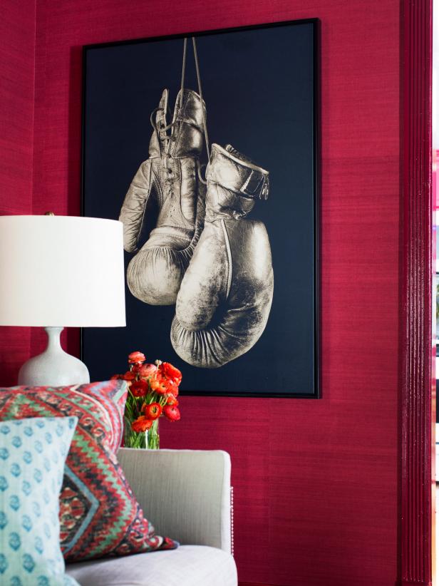 Framed Boxing Gloves Print Hanging on Red Grass-Cloth-Covered Wall