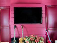 Red Media Wall Conceals Electronic Components Around Flat-Screen TV
