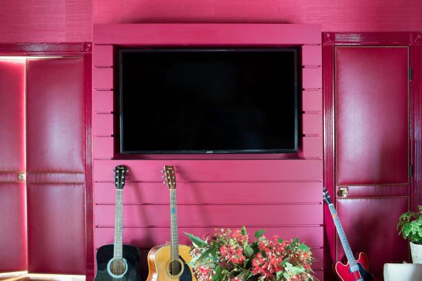 Red Media Wall Conceals Electronic Components Around Flat-Screen TV