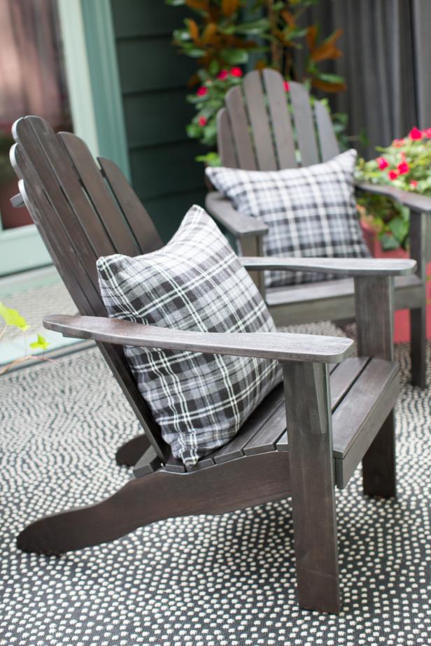 Pair of Adirondack Chairs With Plaid Throw Pillows | HGTV