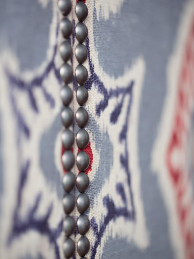 Close-Up of Nail-Head Trim on Fabric-Covered Bifold Laundry Room Doors