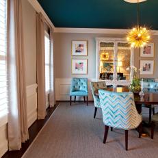 Dining Room With Blue Ceiling and Sunburst Chandelier