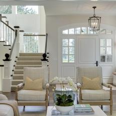 Contemporary White Foyer with Staircase and Large Windows