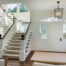 Contemporary White Entryway and Foyer with Large Front Door and Staircase