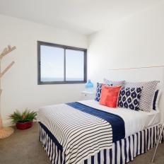 Minimalist Bedroom Features Navy Blue & White Bedding