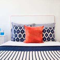 Bedroom Features Navy Ikat Pillows & Striped Bedding