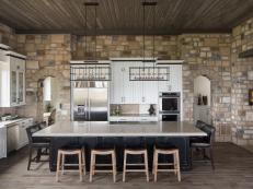 Rustic Brown & Neutral Stone Kitchen With Black Island