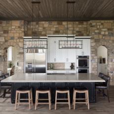 Eat-In Kitchen Features Stone Walls & Spacious Island for Dining