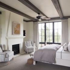 Master Bedroom Features Exposed Beam Ceiling & Gray Accents