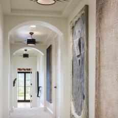 Hallway With Modern Art, Funky Black Pendant Lights & Arched Doorways