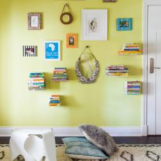 Fun & Colorful Kids Room Features Floating Shelves & Gallery Wall