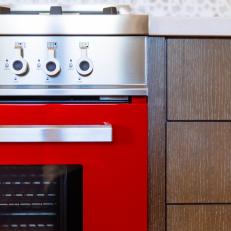 Bold Red Oven & Stainless Steel Cooktop