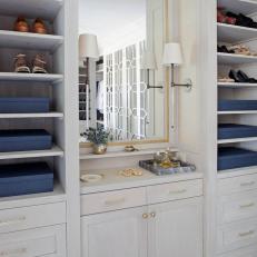 White Walk-In Closet With Gold Trimmed Mirror