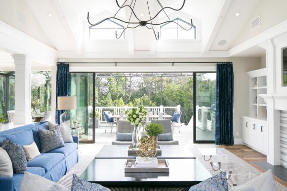 Transitional Neutral Living Room With Blue Sofa and Blue Curtains