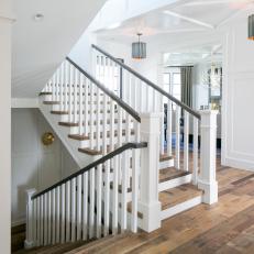 Classic Staircase With Variegated Wood Floors