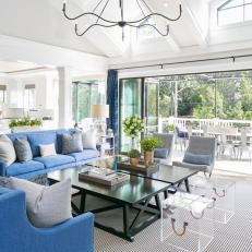 Transitional Living Room Features Rich Blue Sofas