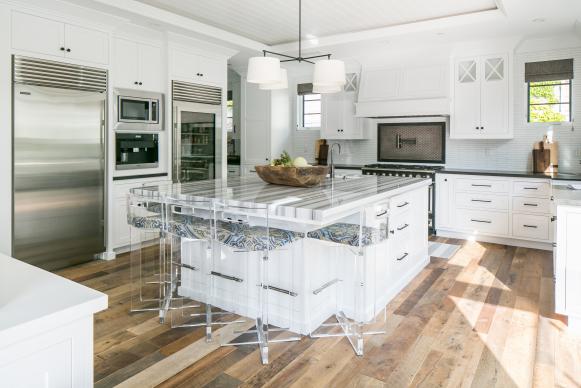 Kitchen With White Cabinets, White Island and Acrylic Barstools