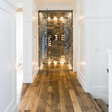 Rustic Stone Wine Room Wows in Crisp White Hall