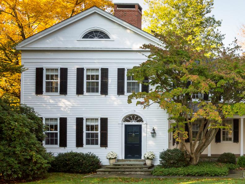 White Colonial House on Tree-Shaded Five-Acre Lot
