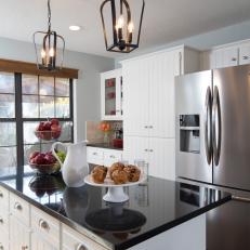 Pale Blue Cozy Kitchen Featuring Glass-Less Lantern Pendants, Textured Wood Cabinets and Polished Granite Countertop
