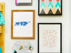 Dorm Room Gallery Wall With Adhesive Photo Strip Mounted Mixed Artwork Featuring an Assortment of Patterns and Color 