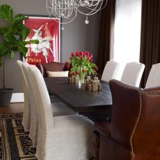 Bright Transitional Dining Room With Gray Walls, Slipcover Chairs, Brown Leather Head Chairs and Deep Wood Dining Table