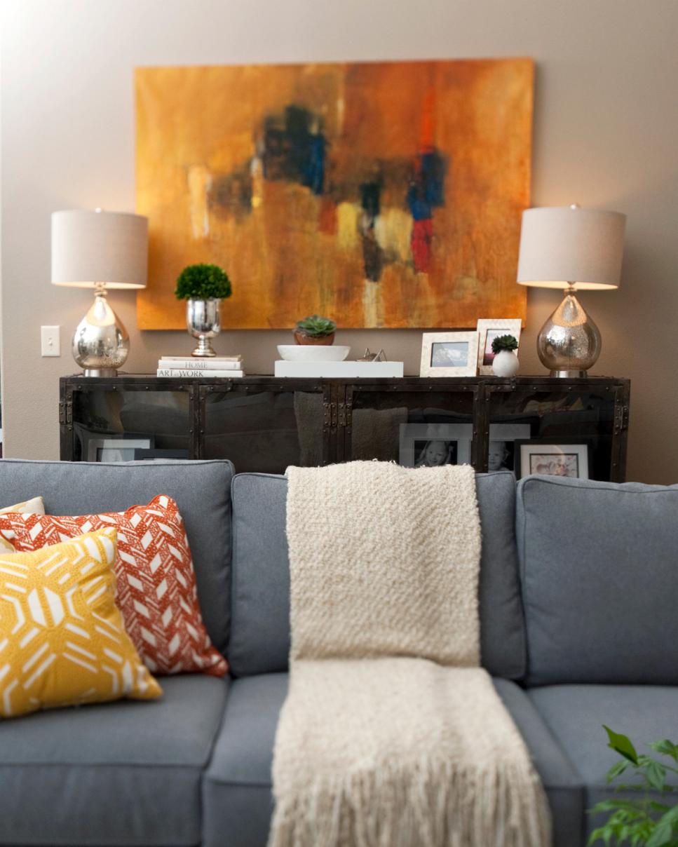 Living Room With Yellow and Orange Modern Art | HGTV