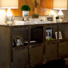 Trunk-Inspired Sideboard Topped With Matching Silver Lamps