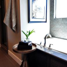 Bathtub With Metallic Side Table in Contemporary Bathroom