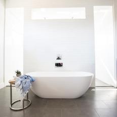 Minimalist, White Bathroom With Free-standing Modern Tub