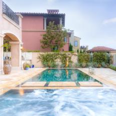 Luxurious Mediterranean Pool Deck With Marble Flooring, Dividing Pool Walkway and Decorative Plant Border 