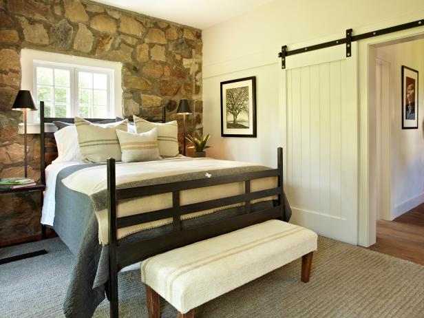 Cottage Bedroom With Barn Door And Stone Accent Wall Hgtv