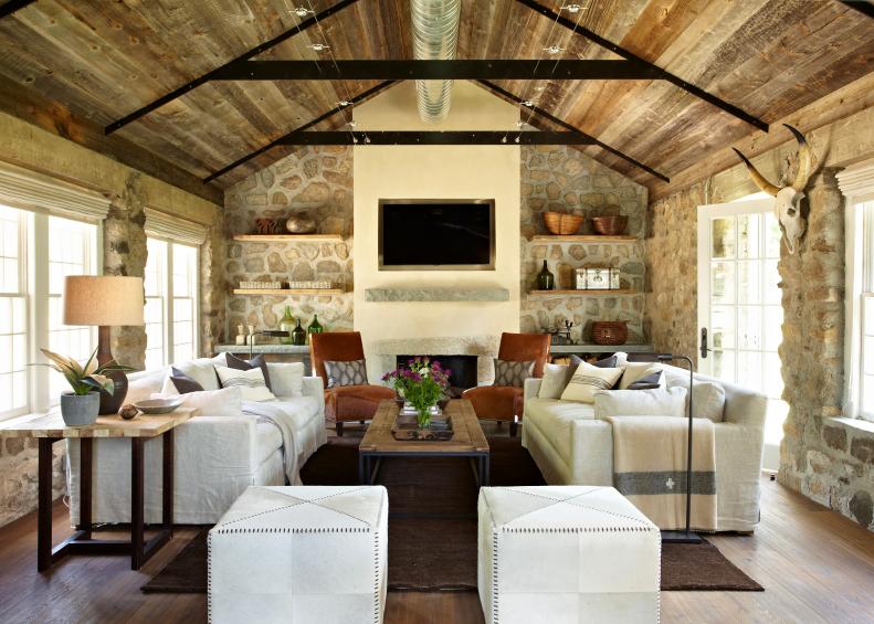 Cottage Great Room With Stone Walls and Two White Sofas