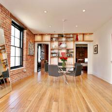 Loft Living Space With Wood Floors & Exposed Brick Walls
