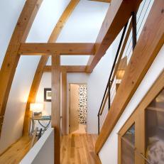 Hallway in a Modern Home with Exposed Wood Beams on the Ceilings and Walls
