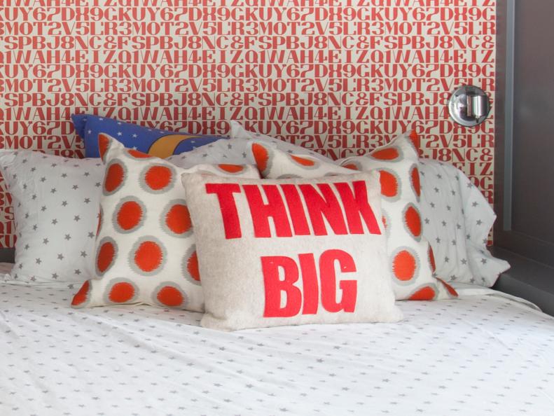 View of Boys' Bedroom With Red Lettered Wallpaper and Pillow