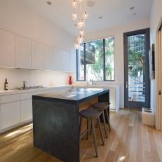 Modern Kitchen With White Cabinets, Custom Island & Hardwood Flooring